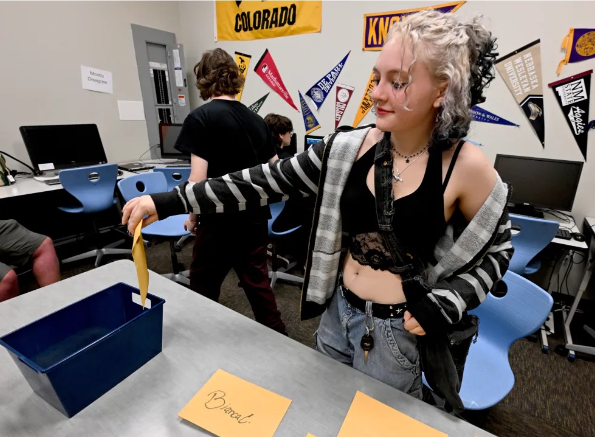 Raven Servetar puts her phone in an envelope before class at Boulder Preparatory High School, a charter school in Gunbarrel, in this August file photo.